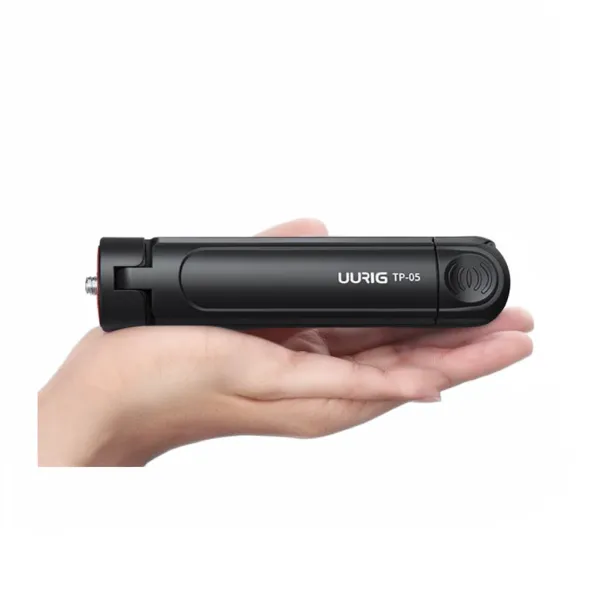 Mini trépied pliable EHANG support bureau pour smartphone et appareils légers Mini trépied pliable EHANG tenu dans une main, support bureau pour smartphone et appareils légers