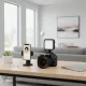 Luminaire LED vidéo portable NVPONE 3000K-7000K mini rechargeable monté sur appareil photo DSLR à côté d'un smartphone sur un bureau