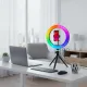 Anneau LED RGB dimmable avec trépied et support téléphone posé sur un bureau moderne