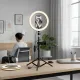 LED selfie ring lamp Mrgabwte avec trépied et télécommande sur un bureau en lumière chaude